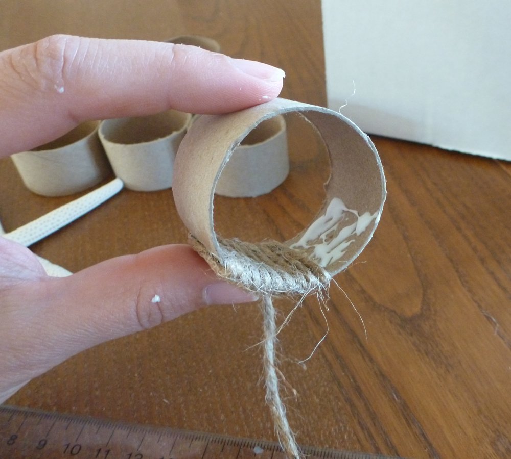 Explore Southern Living Tear the pages into 1 inch by 3 inch strips. Paint the strips onto the napkin rings using the decoupage glue, and layer them as you go so that the entire ring is covered. Wrap the pages over the edge of the napkin ring and glue them in place on the inside to cover the edge. Let it dry.